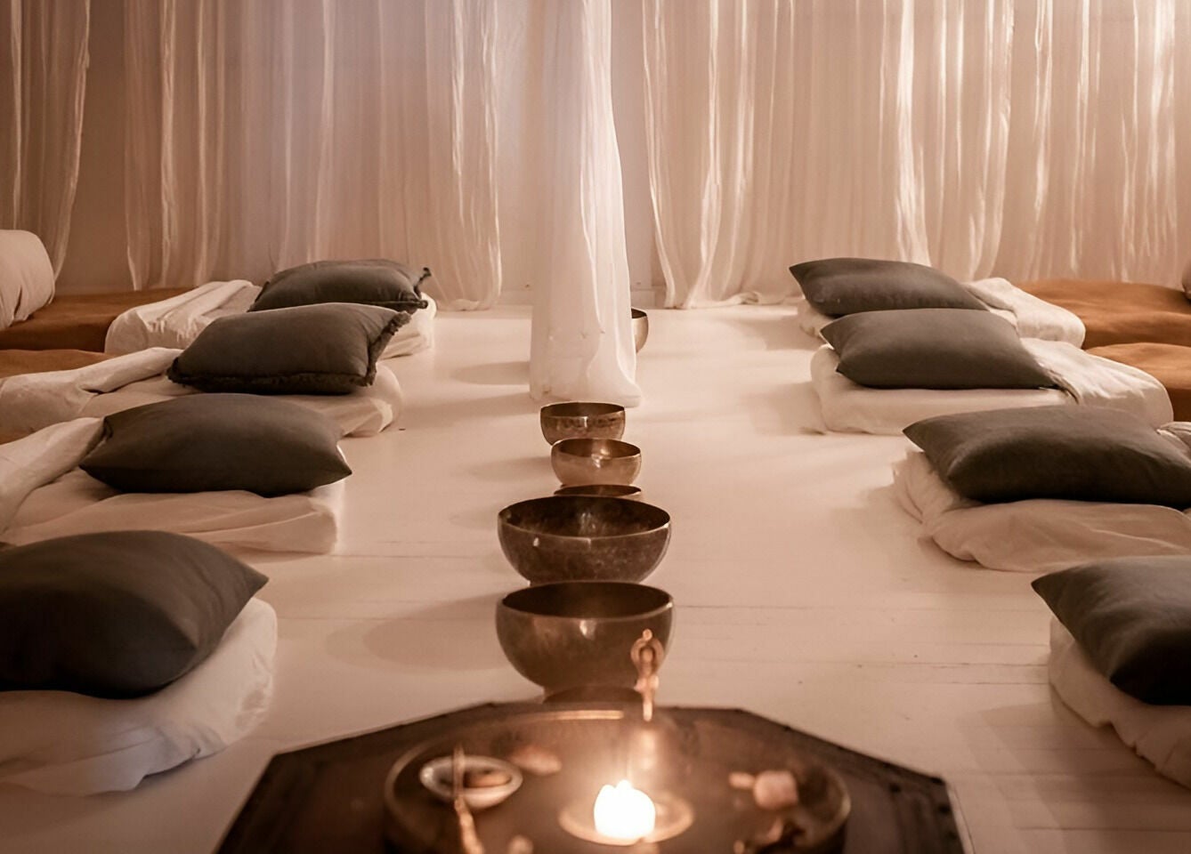 Tranquil meditation room at Chakana Day Spa + Wellbeing in Avalon Beach, New South Wales, AU, with cozy cushions.