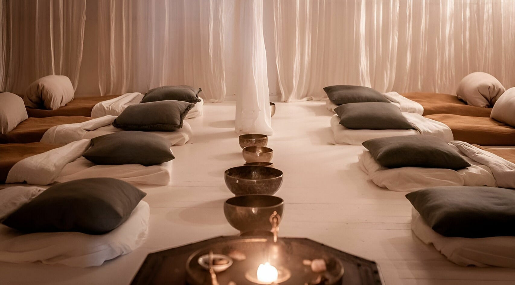 Tranquil meditation room at Chakana Day Spa + Wellbeing in Avalon Beach, New South Wales, AU, with cozy cushions.