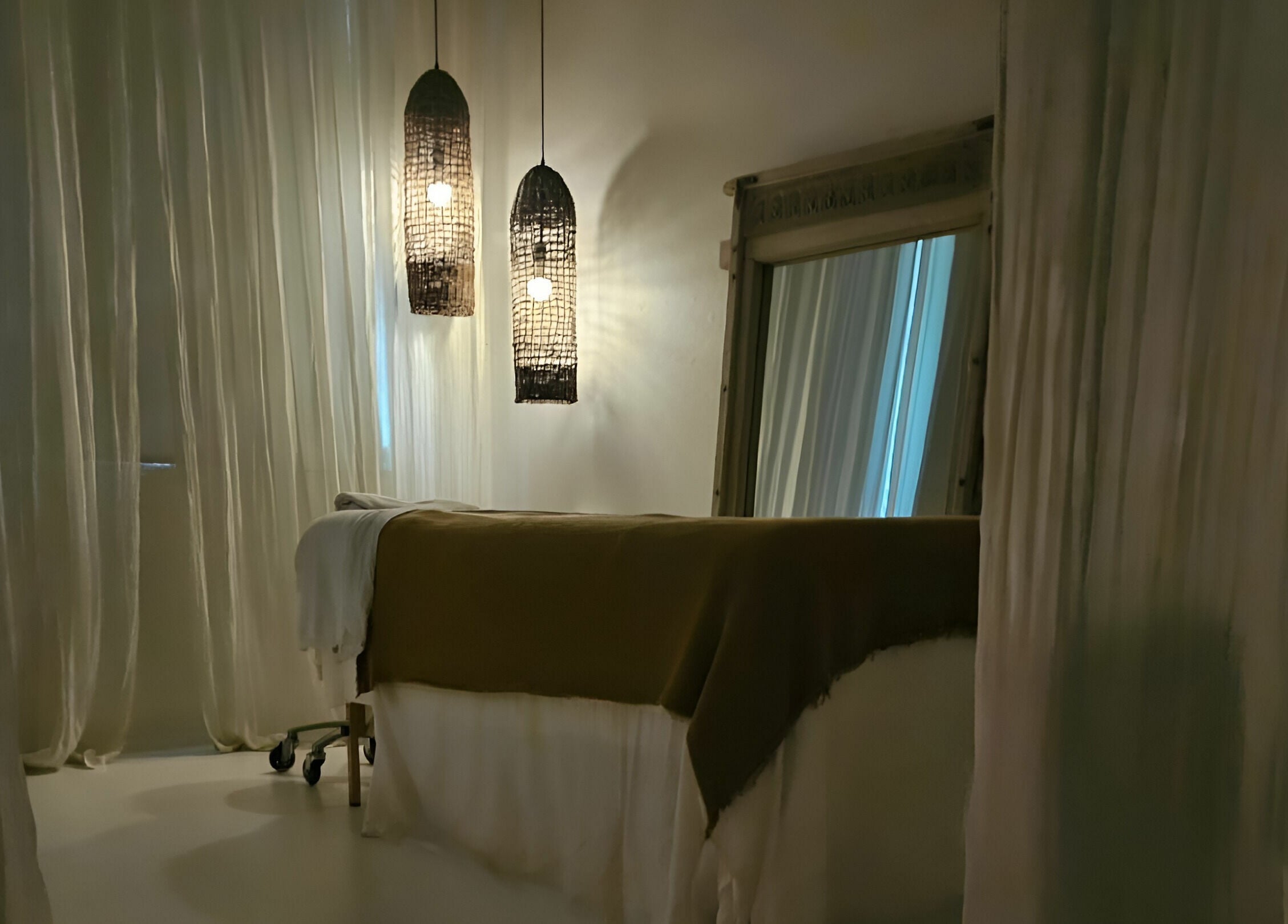 Relaxing treatment room at Chakana Day Spa + Wellbeing, Avalon Beach, New South Wales, AU with calming lighting.