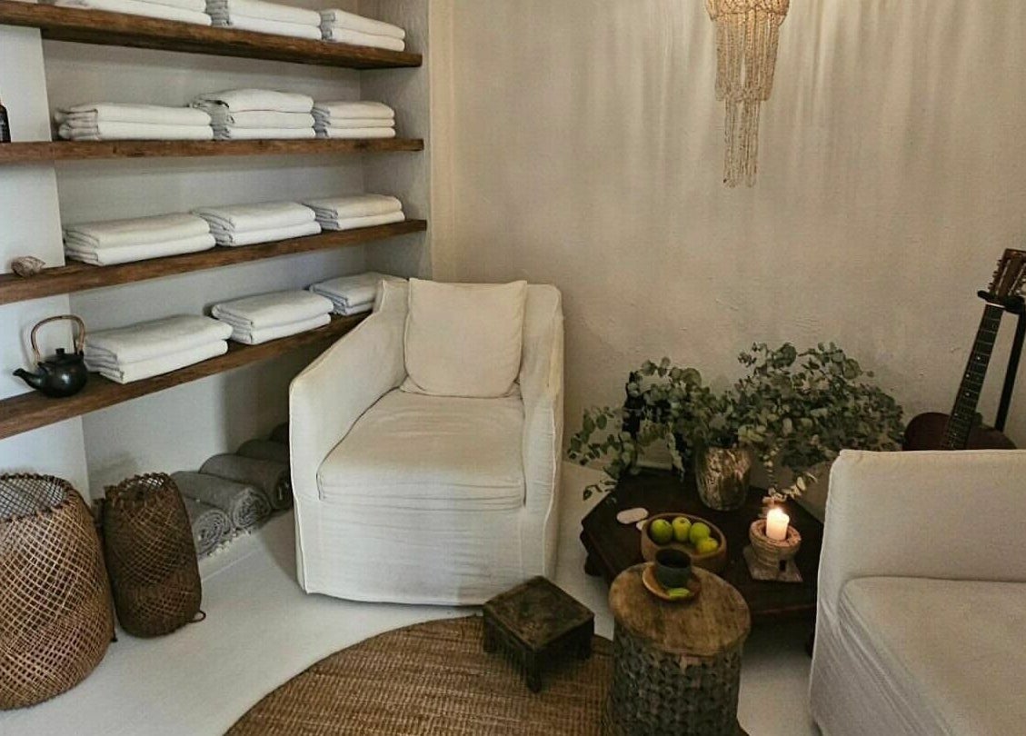 Relaxing lounge area at Chakana Day Spa + Wellbeing, Avalon Beach, New South Wales, AU with cozy seating and decor.