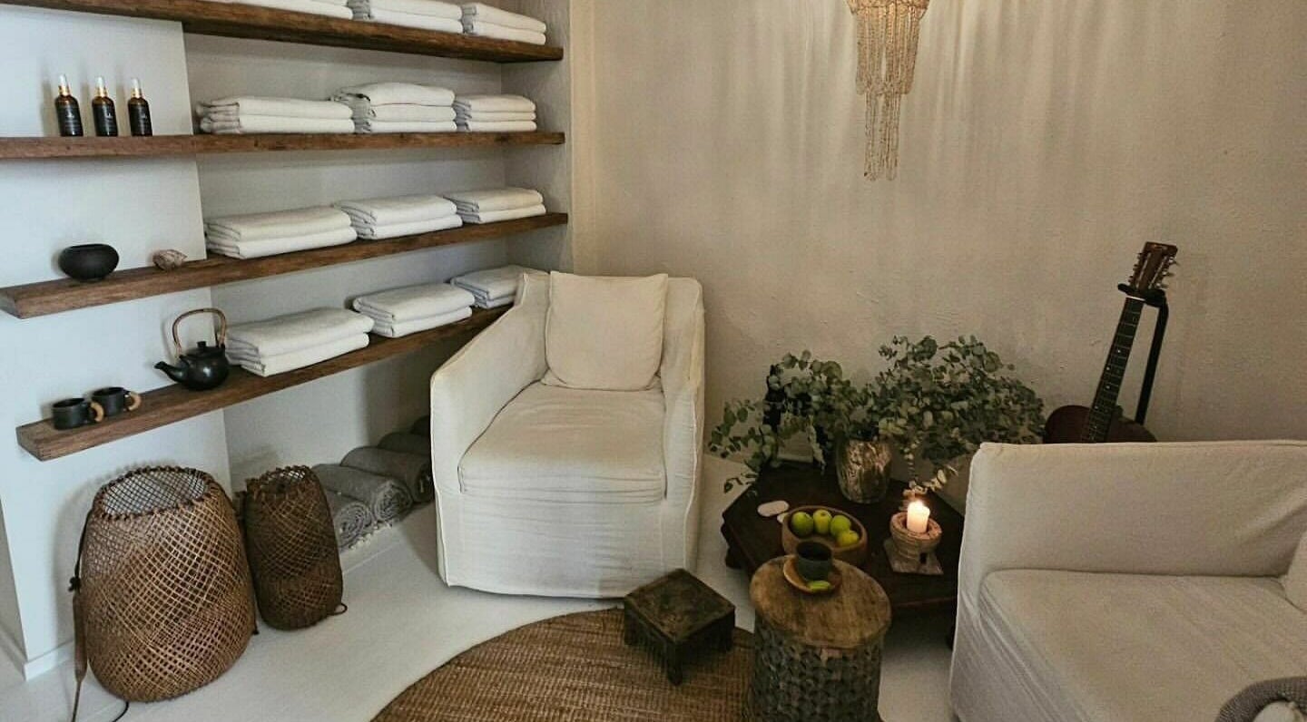 Relaxing lounge area at Chakana Day Spa + Wellbeing, Avalon Beach, New South Wales, AU with cozy seating and decor.