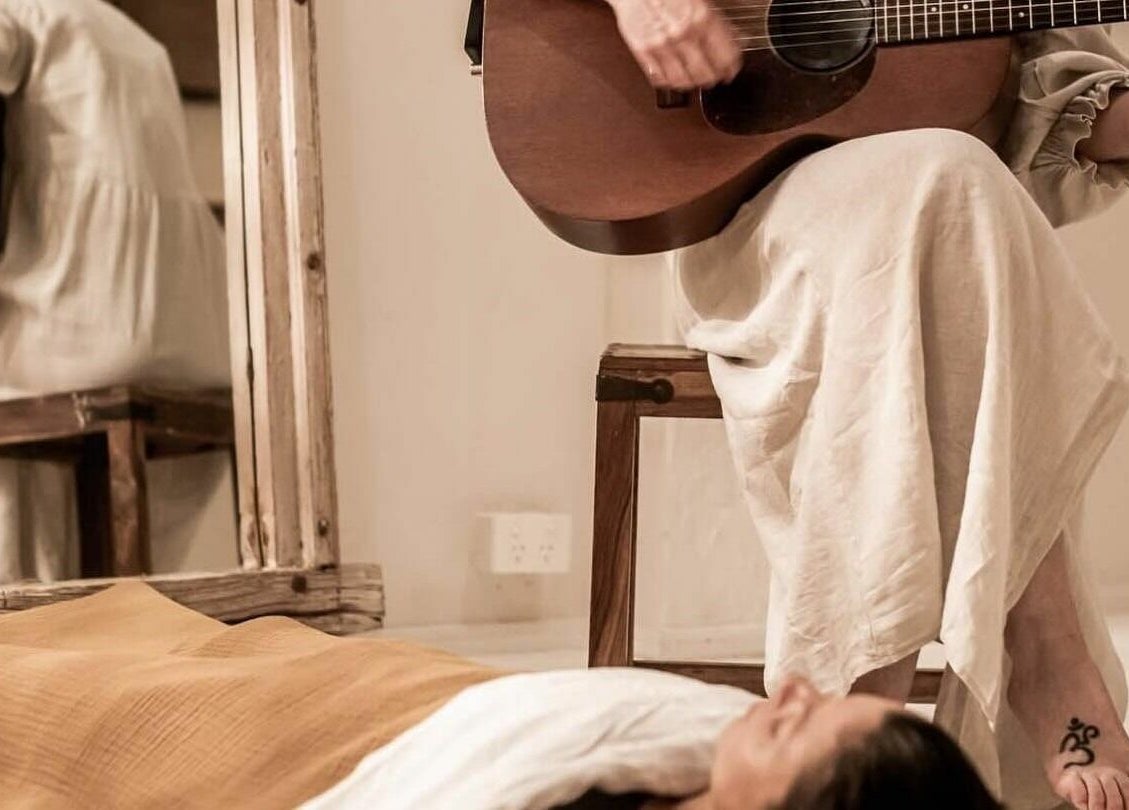 Guitarist plays soothing music at Chakana Day Spa + Wellbeing, Avalon Beach, New South Wales, AU.