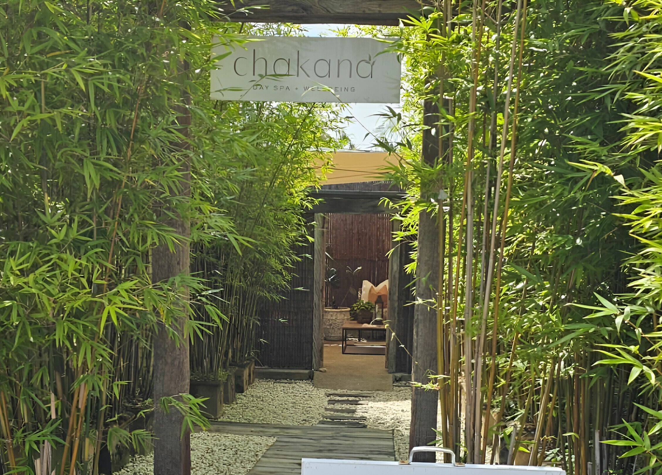 Entrance to Chakana Day Spa + Wellbeing, framed by lush bamboo, Avalon Beach, New South Wales, AU.