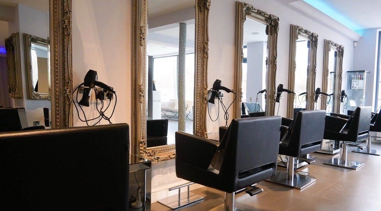 Elegant salon interior at Hair At Tiffanys, featuring ornate mirrors in Langley Moor, England, GB.
