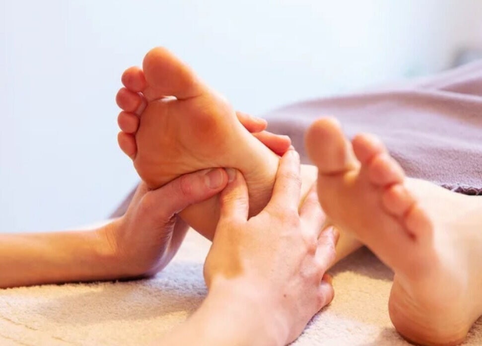 Foot massage at Caring For You Treatments in Salwayash, England, GB, offering soothing wellness experiences.