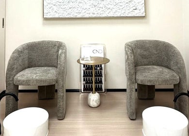 Elegant pedicure area at Skin Harmony Beauty Salon, Dubai, Dubai, AE, featuring plush chairs and modern decor.