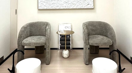 Elegant pedicure area at Skin Harmony Beauty Salon, Dubai, Dubai, AE, featuring plush chairs and modern decor.