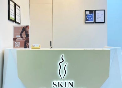 Modern reception at Skin Harmony Beauty Salon, Dubai, Dubai, AE, with stylish decor and certification displays.