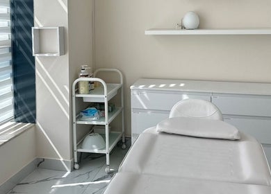 Treatment room at Skin Harmony Beauty Salon, Dubai, Dubai, AE, featuring a cozy bed and calming decor.