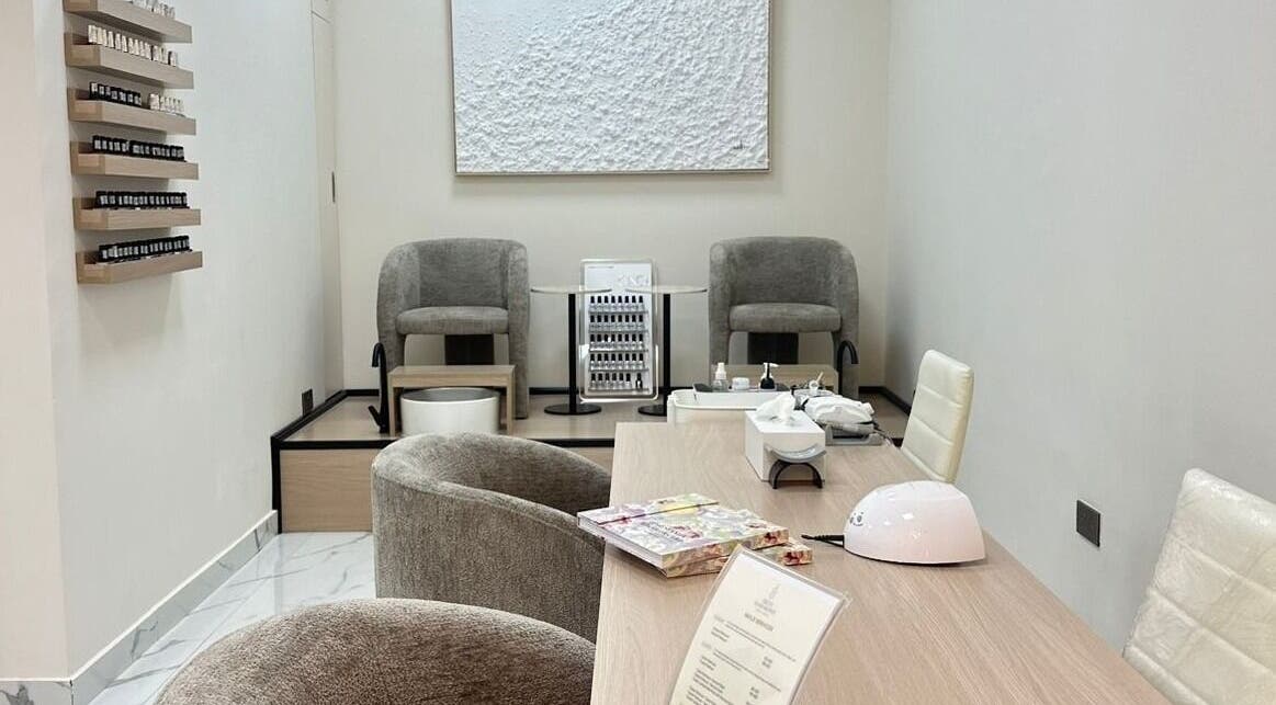 Elegant nail care room at Skin Harmony Beauty Salon in Dubai, Dubai, AE with modern decor and plush seating.