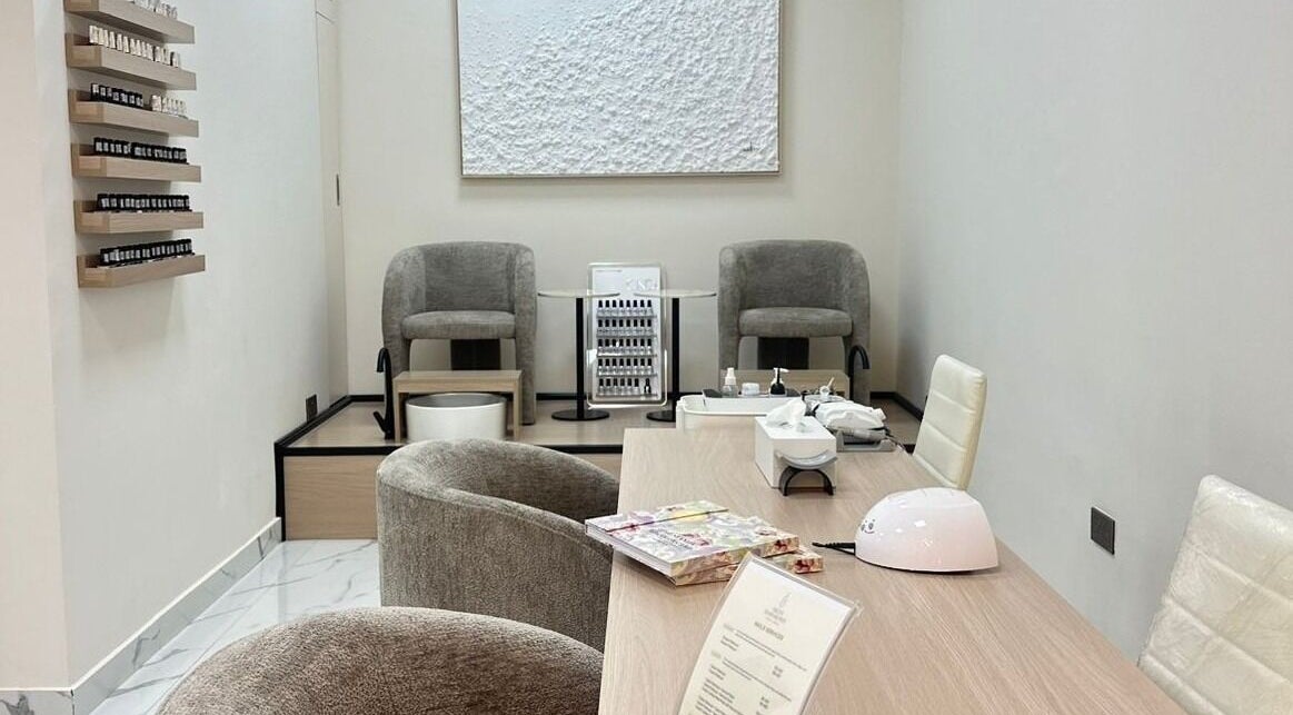 Elegant nail care room at Skin Harmony Beauty Salon in Dubai, Dubai, AE with modern decor and plush seating.