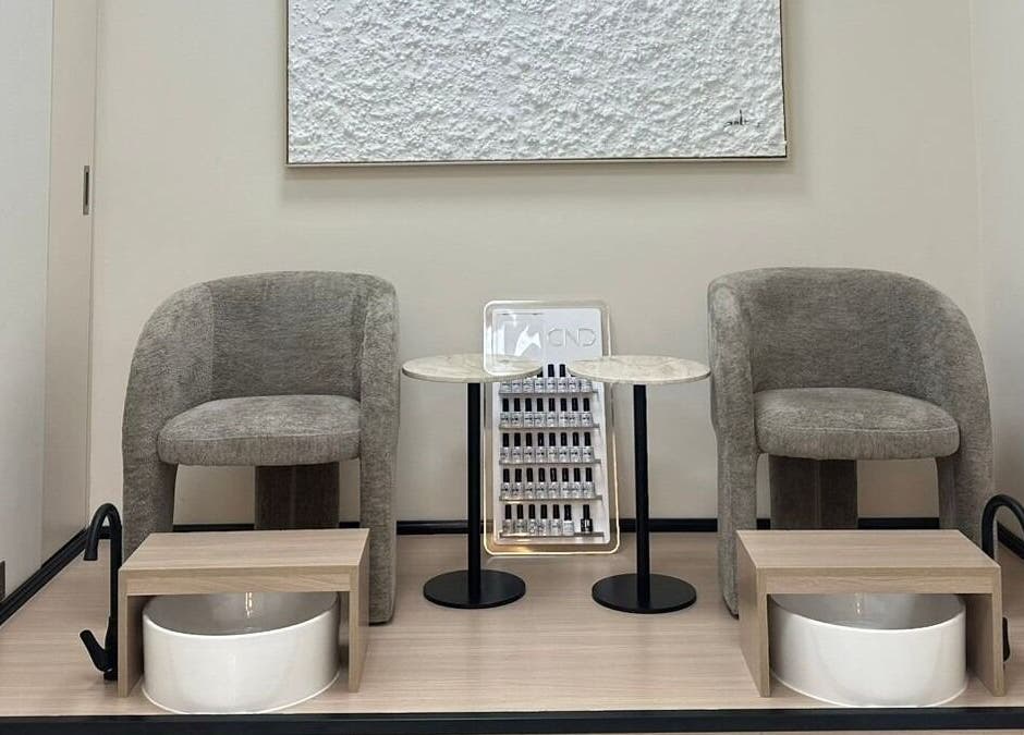 Elegant pedicure area at Skin Harmony Beauty Salon in Dubai, Dubai, AE showcasing modern seating and stylish decor.