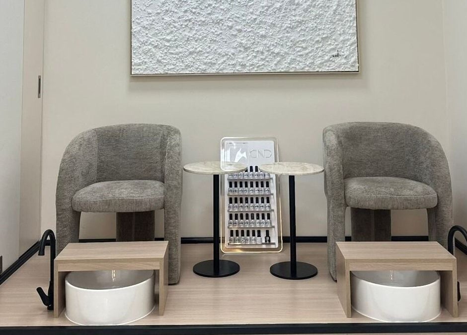 Elegant pedicure area at Skin Harmony Beauty Salon in Dubai, Dubai, AE showcasing modern seating and stylish decor.