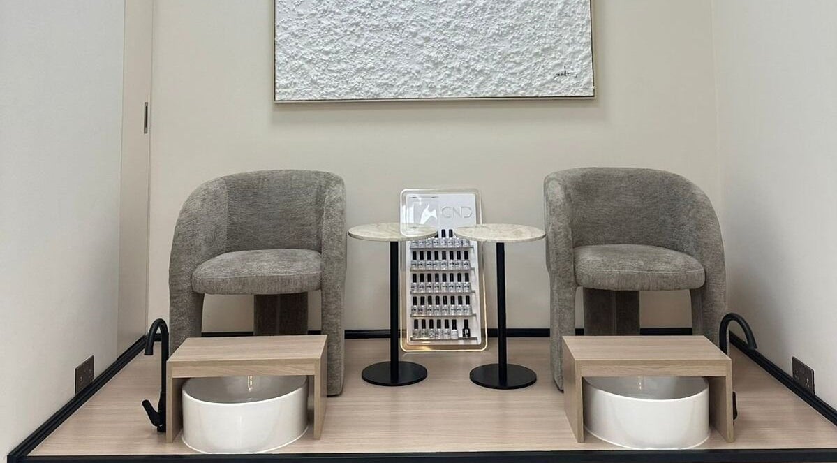 Elegant pedicure area at Skin Harmony Beauty Salon in Dubai, Dubai, AE showcasing modern seating and stylish decor.