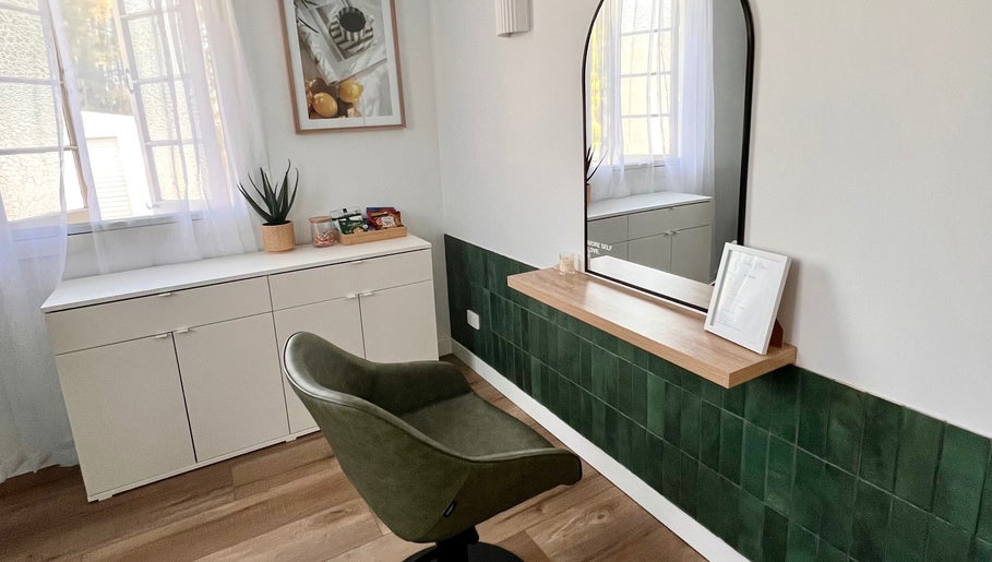 Elegant styling chair and mirror setup at Hair by Denielle in Kedron, Queensland, AU offering a serene ambiance.
