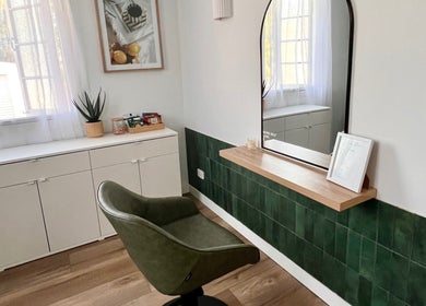 Elegant styling chair and mirror setup at Hair by Denielle in Kedron, Queensland, AU offering a serene ambiance.