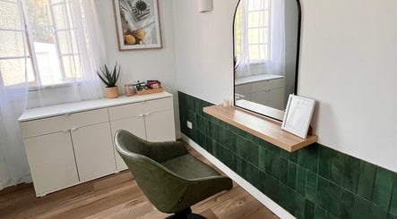 Elegant styling chair and mirror setup at Hair by Denielle in Kedron, Queensland, AU offering a serene ambiance.