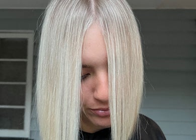 Sleek blonde hairstyle at Hair by Denielle, Kedron, Queensland, AU showcasing modern design.