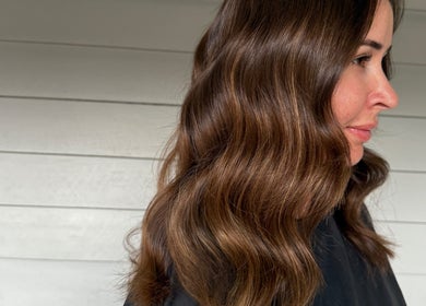 Glossy brown waves hairstyle at Hair by Denielle, Kedron, Queensland, AU showcasing elegant hair styling.