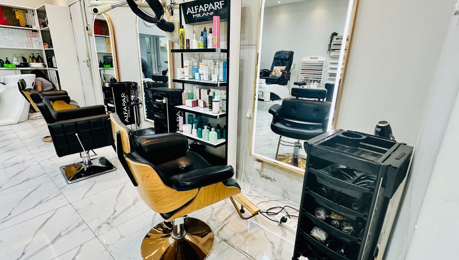 Interior of Golden Lotus Beauty Salon in Sharjah, AE featuring styling chairs and beauty products.