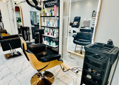 Interior of Golden Lotus Beauty Salon in Sharjah, AE featuring styling chairs and beauty products.