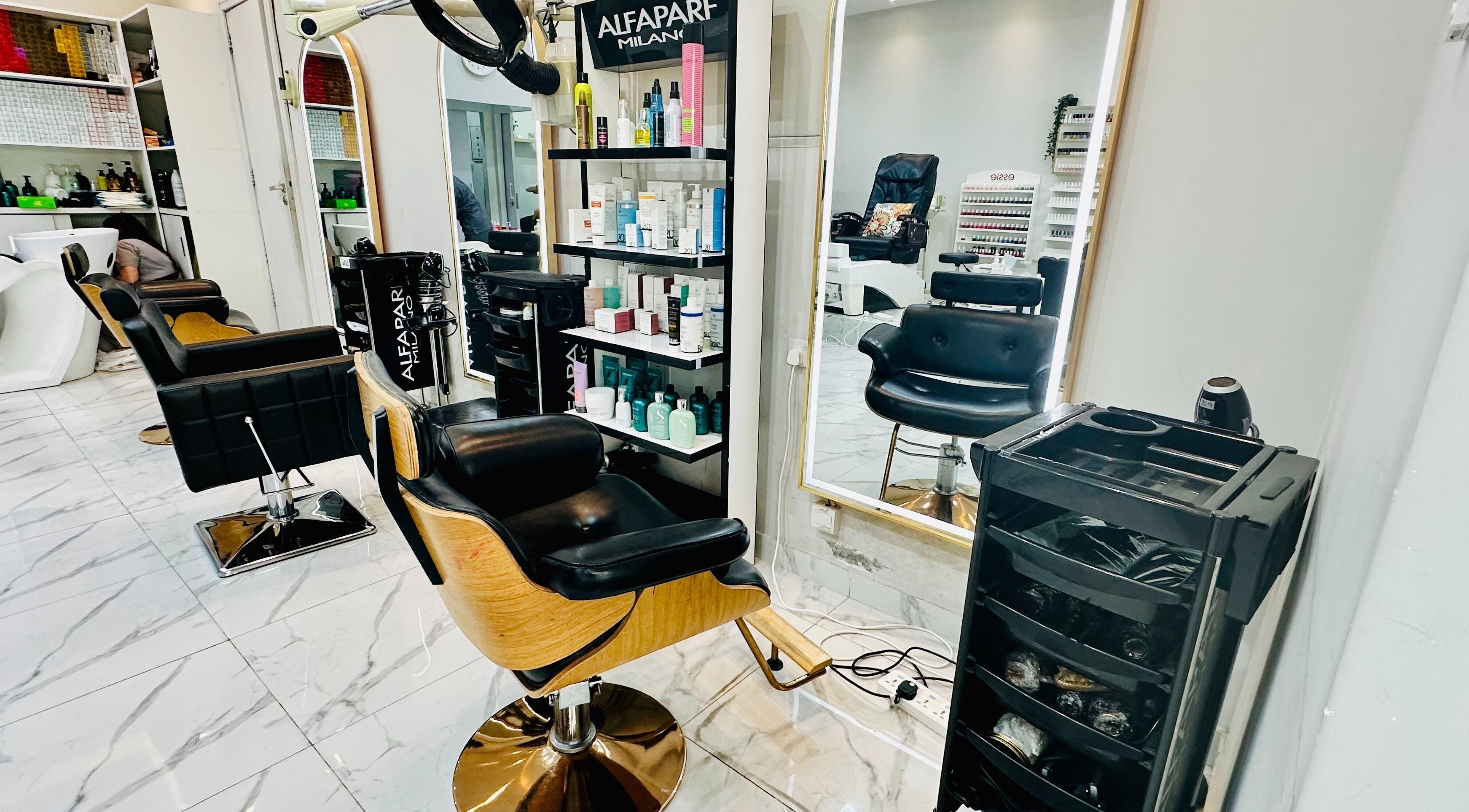Interior of Golden Lotus Beauty Salon in Sharjah, AE featuring styling chairs and beauty products.