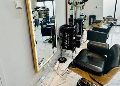 Modern interior of Golden Lotus Beauty Salon, Sharjah, AE, featuring sleek salon chairs and mirrors.