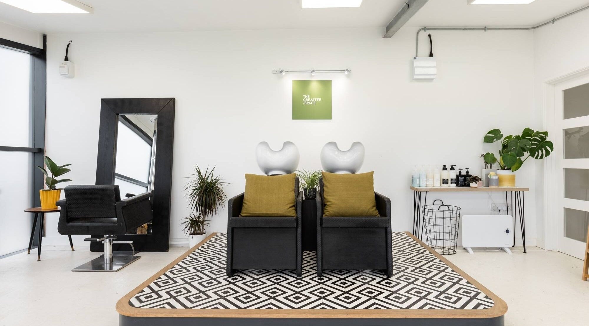 Modern salon interior at Hayley Edwards, Creative Space Kent, Faversham, England, GB with stylish chairs and decor.