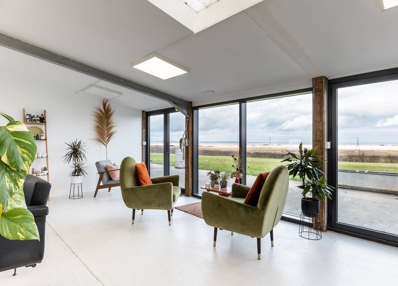 Relaxing lounge at Hayley Edwards in Creative Space Kent, Faversham, England with scenic window views.