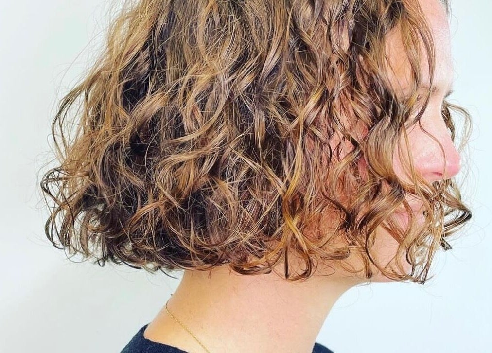 A stylish curly bob haircut by Hayley Edwards at Creative Space Kent, Faversham, England, GB.