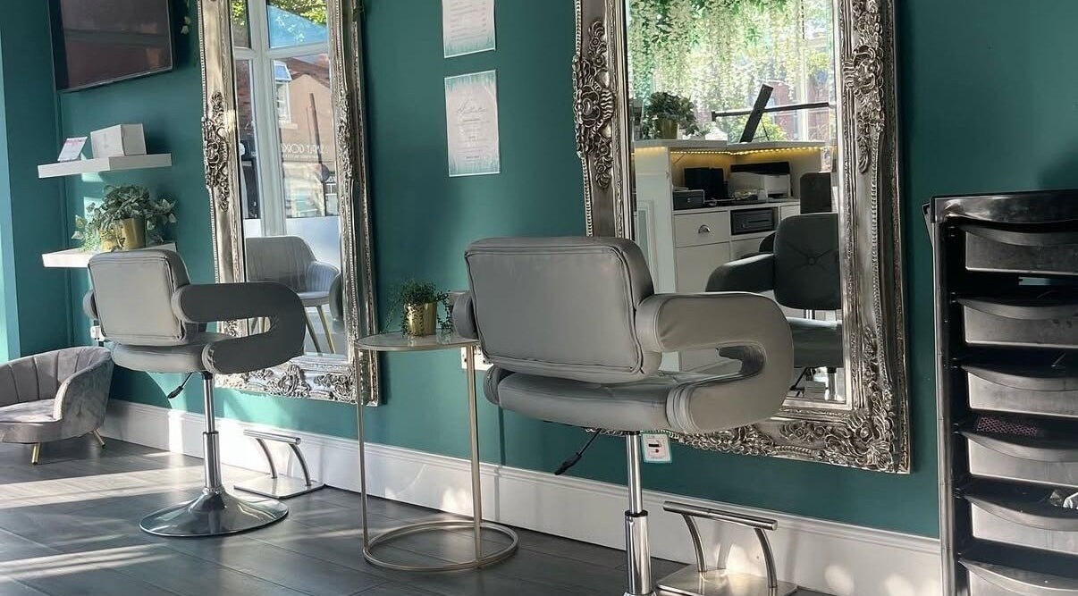 Sophisticated styling chair and ornate mirror in Studio 29, Lytham St Annes, England, GB.
