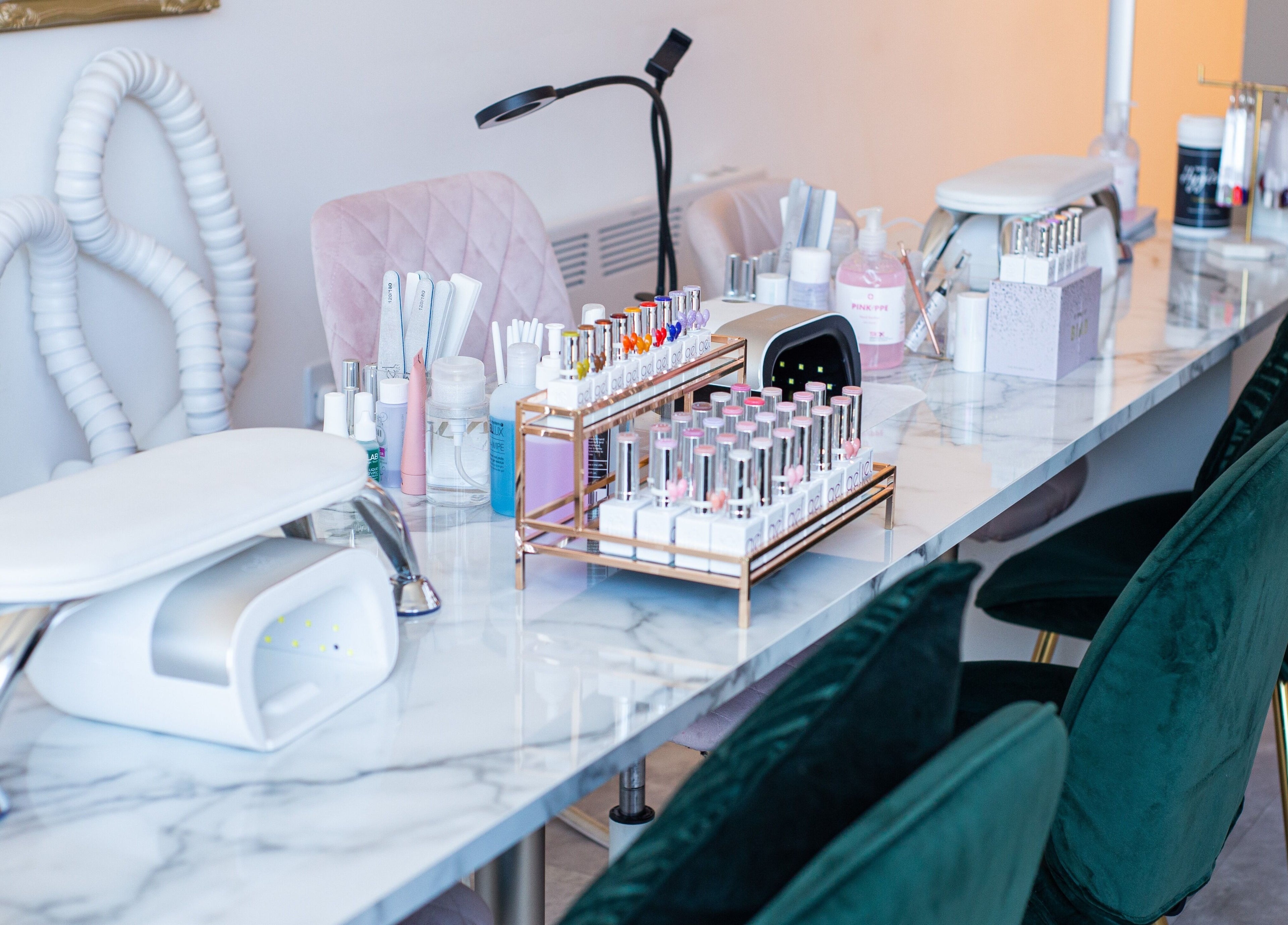 Elegant nail care station at Chloe's Beauty, Carlisle, England, GB, showcasing tools and polishes.