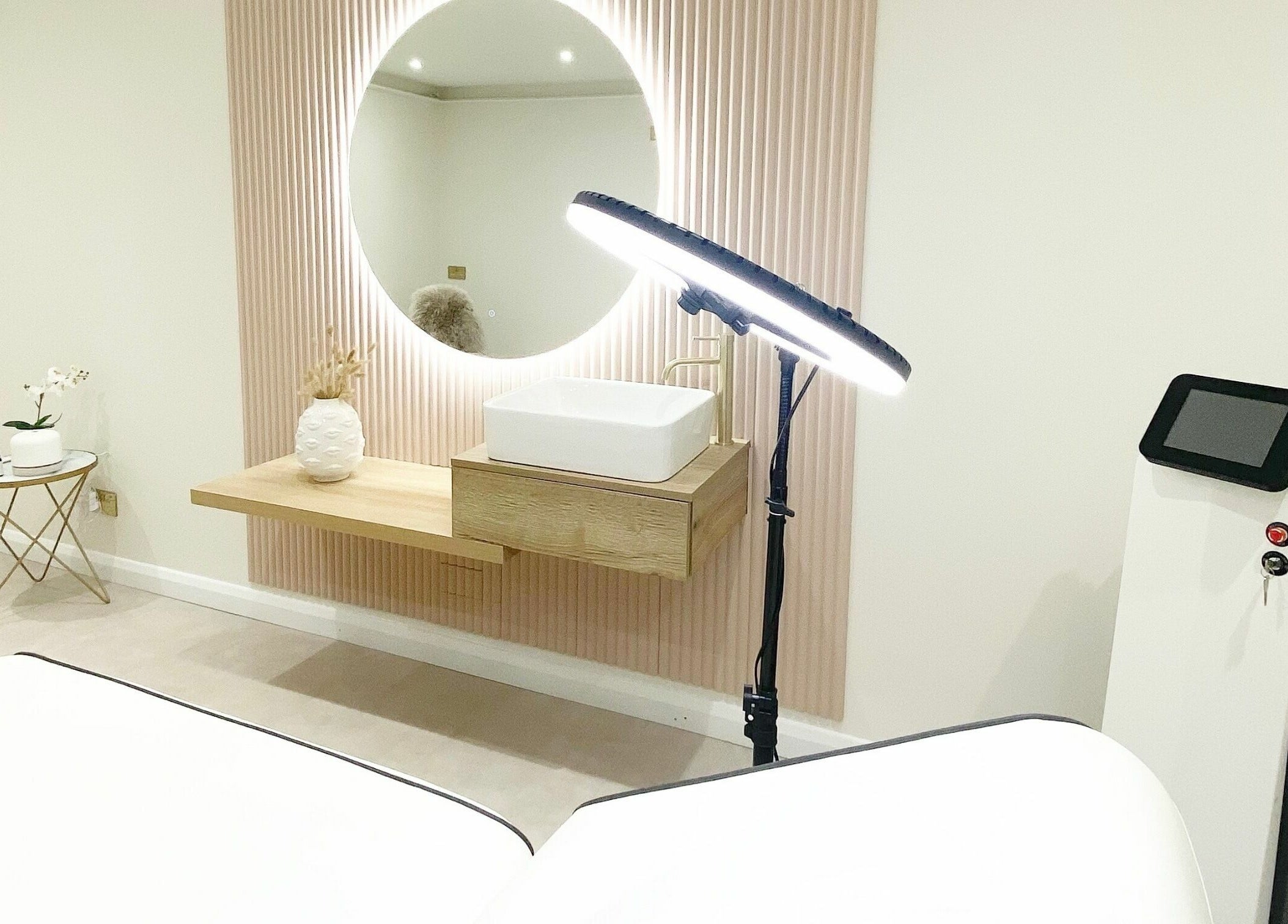 Chic treatment room at Lulu Ink Permanent Makeup and Aesthetics - Buckingham, Bucks, England, GB with modern decor.