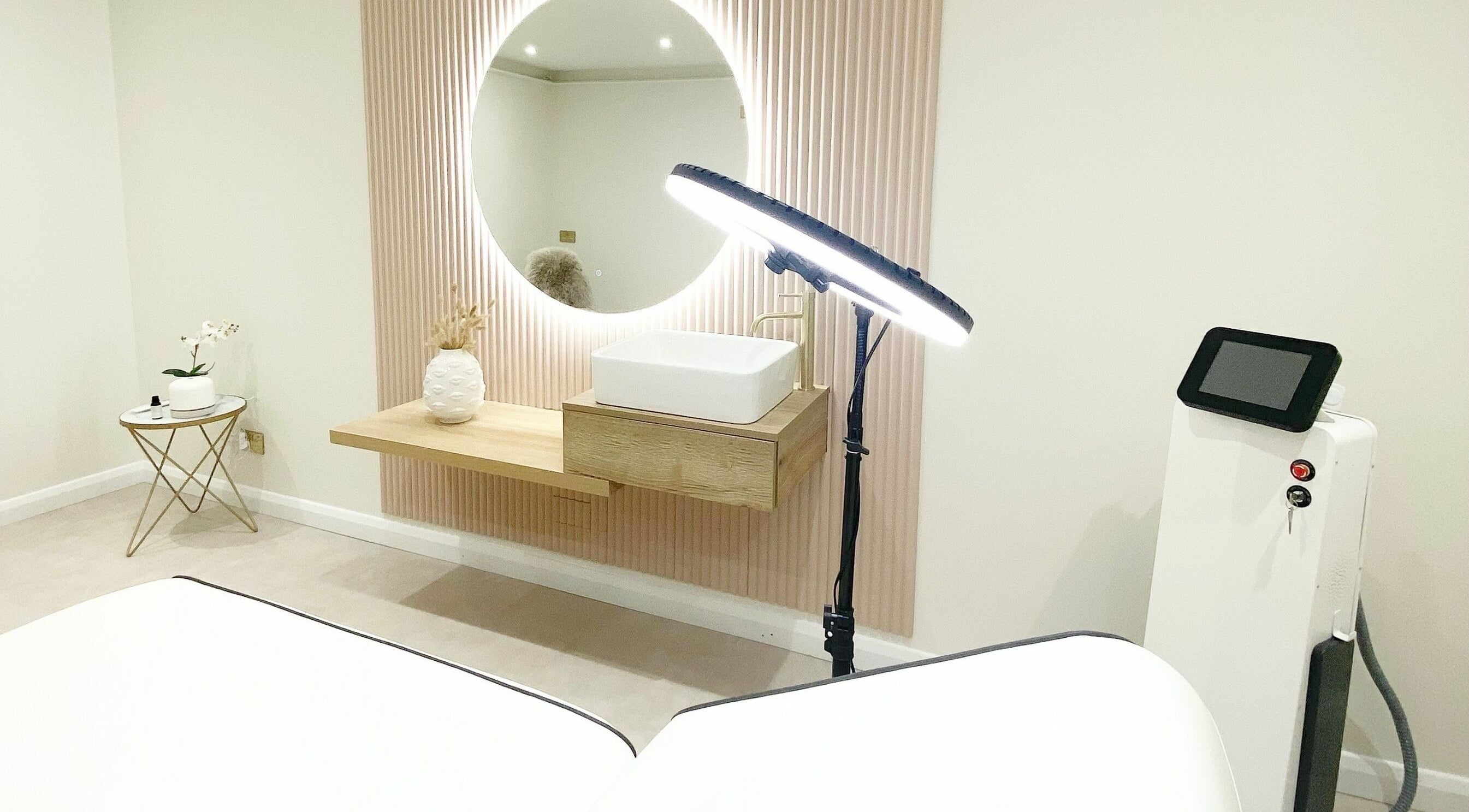 Chic treatment room at Lulu Ink Permanent Makeup and Aesthetics - Buckingham, Bucks, England, GB with modern decor.