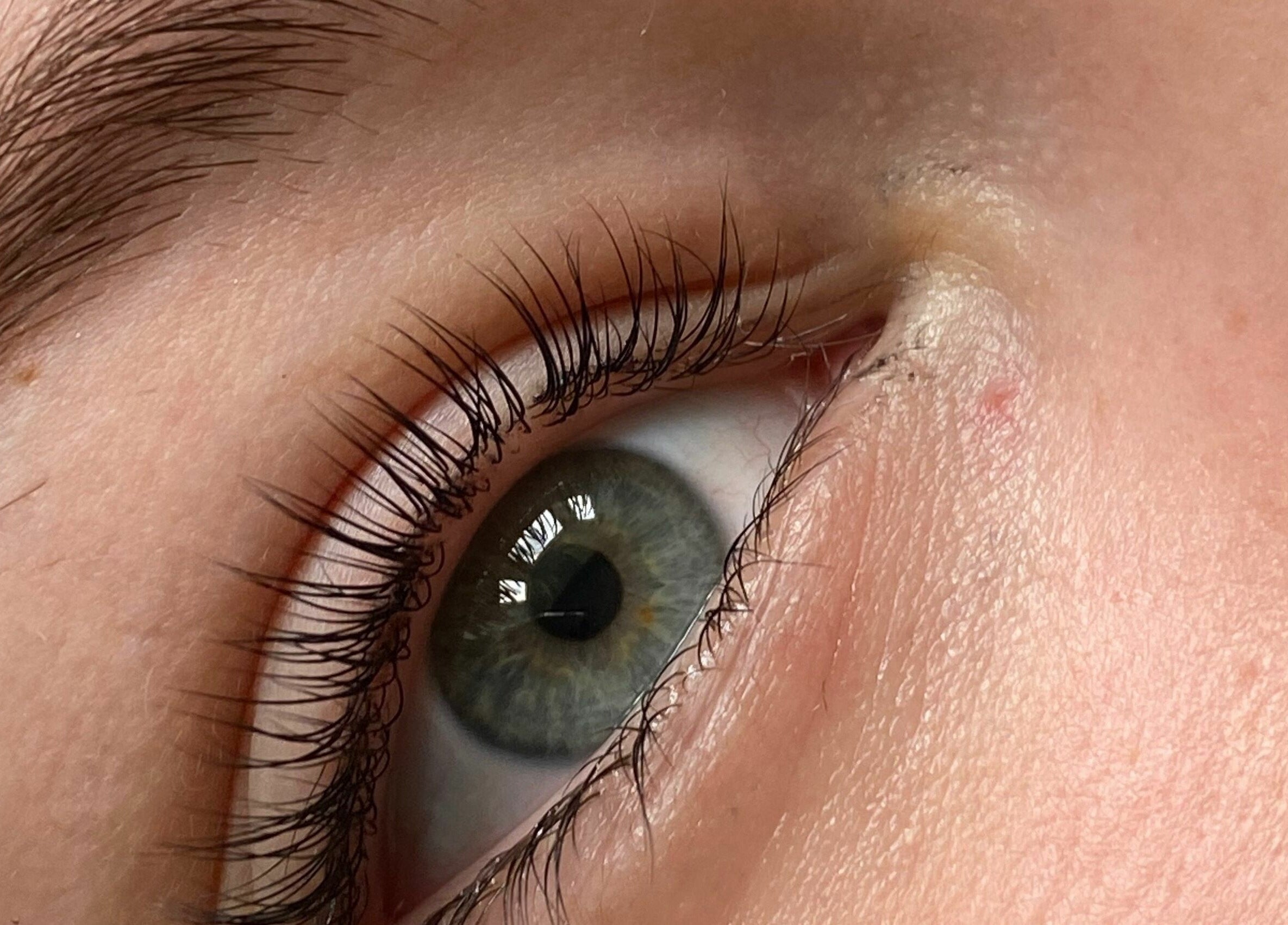 Detailed view of an eye showcasing natural beauty at Lulu Ink Permanent Makeup in Bucks, England, GB.