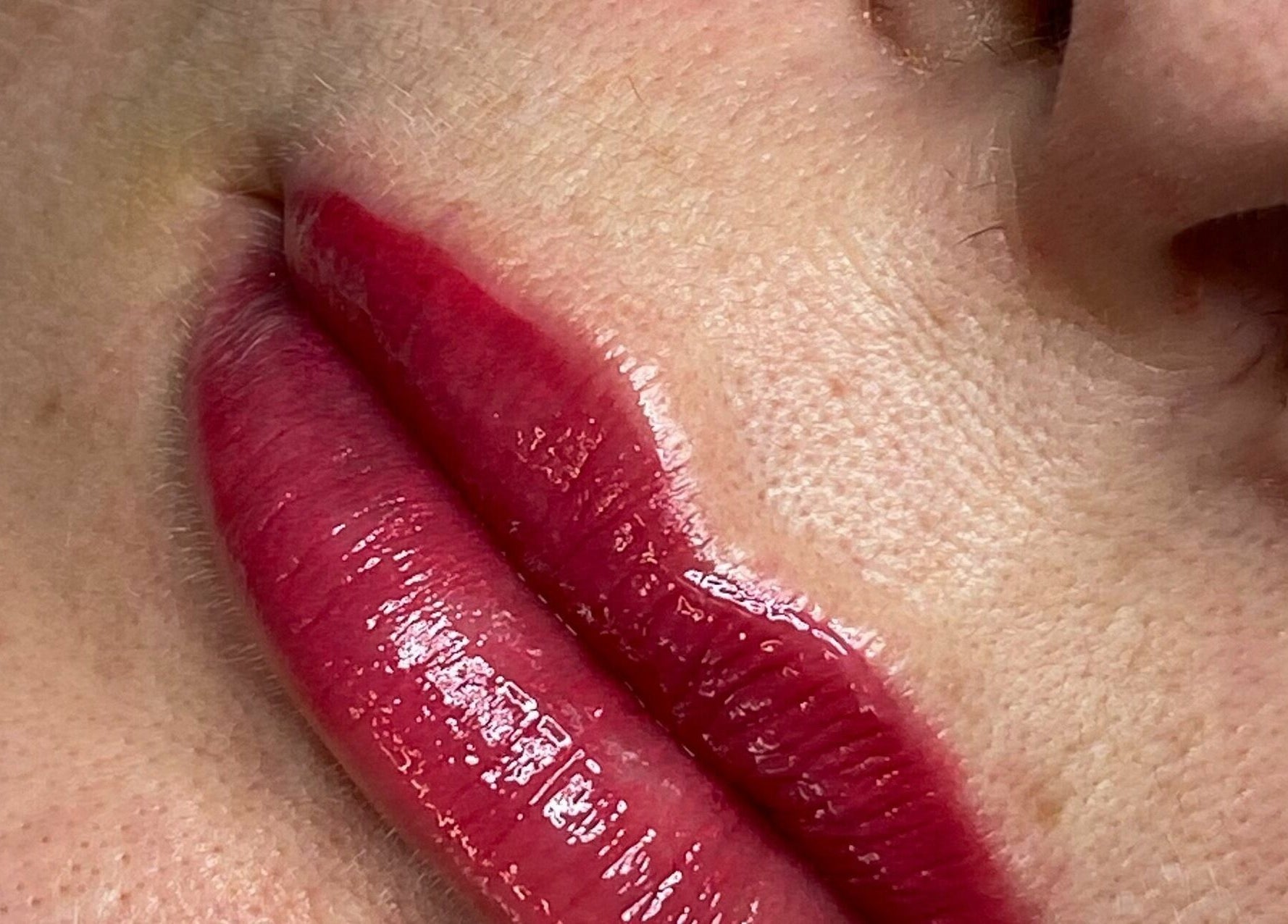 Close-up of vibrant lip color by Lulu Ink Permanent Makeup and Aesthetics - Buckingham, Bucks, England, GB.