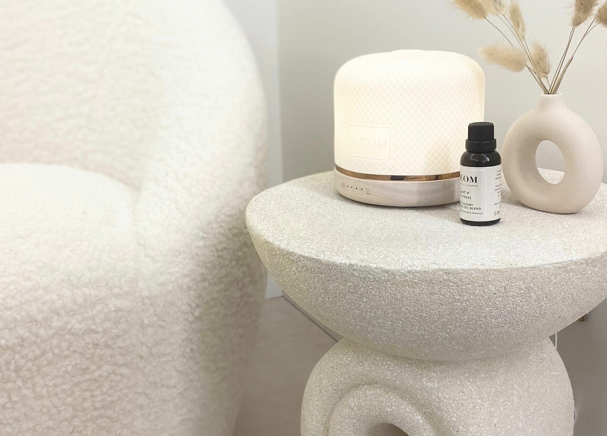 Cozy corner at Lulu Ink Permanent Makeup and Aesthetics - Buckingham, Bucks, England, GB featuring decor and diffuser.