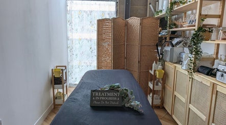 Serene treatment room at IPR Beauty Lounge, London, England, GB with cozy decor and wellness ambiance.