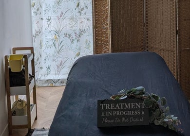 Tranquil treatment room at Indulge Pamper Relax, London, England, GB, with soothing decor.