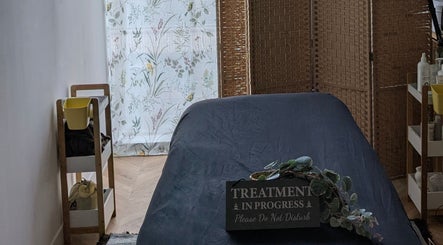 Tranquil treatment room at Indulge Pamper Relax, London, England, GB, with soothing decor.