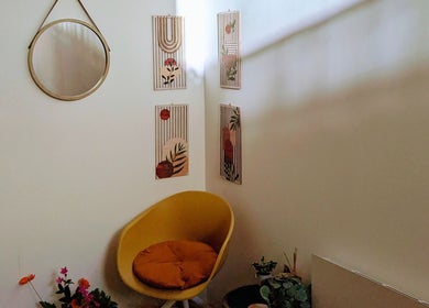 Relax in the inviting corner of Indulge Pamper Relax, London, England, GB. Chic decor and vibrant chair.