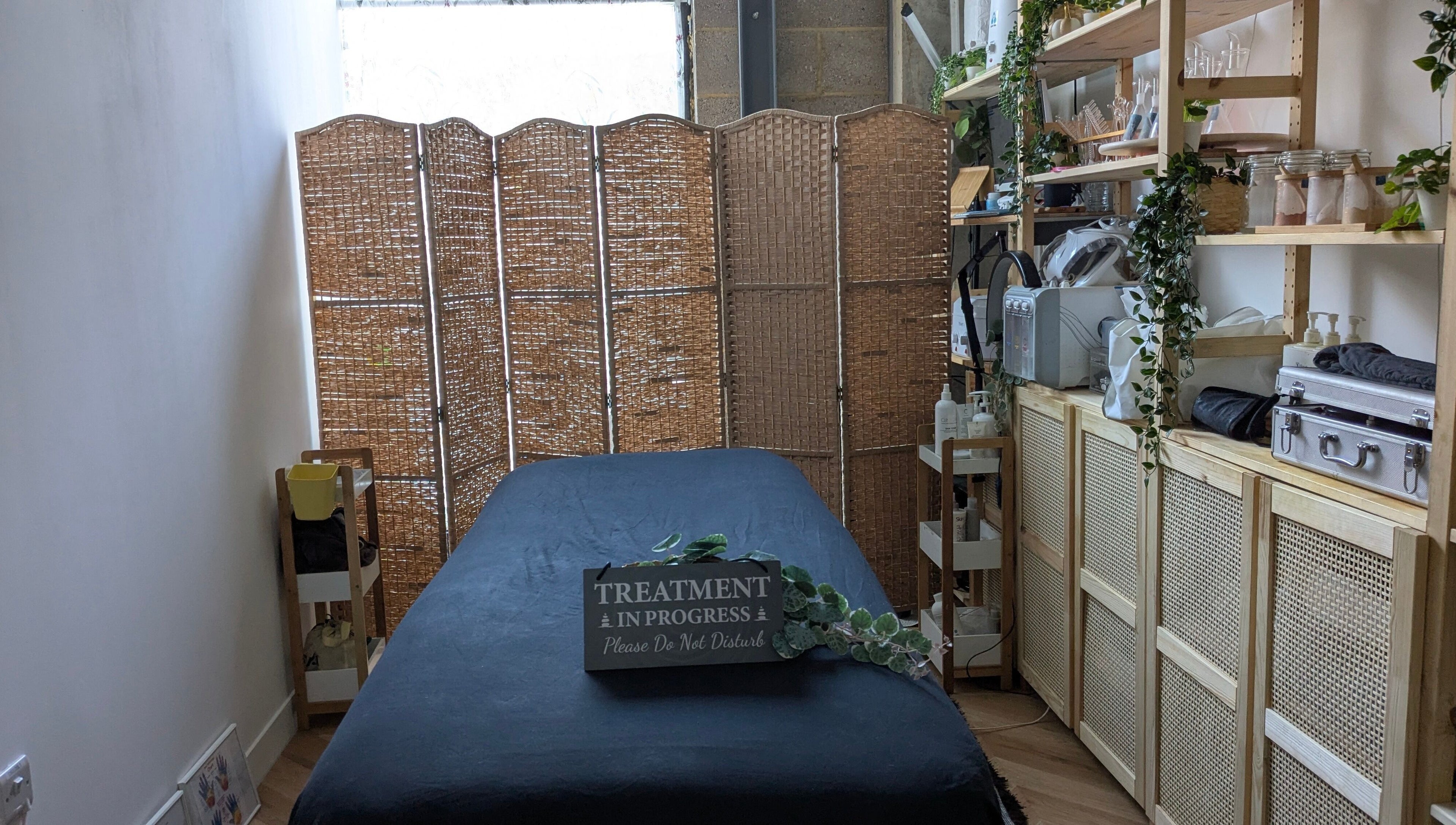 Tranquil spa room at Indulge Pamper Relax-The Pamper Room, London, England, GB. Cozy massage table and decor.