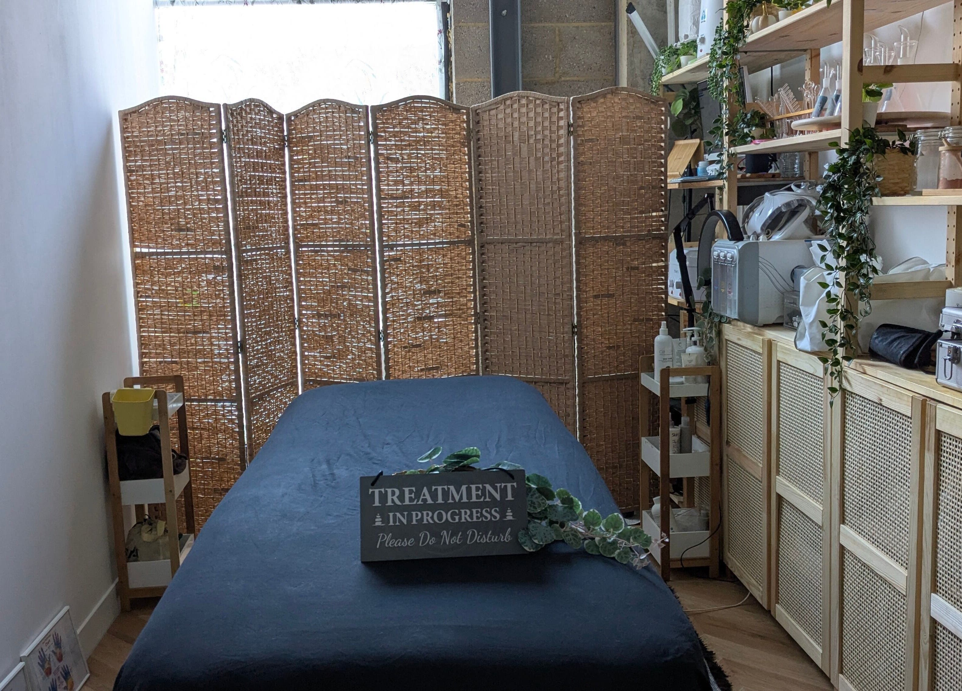 Tranquil spa room at Indulge Pamper Relax-The Pamper Room, London, England, GB. Cozy massage table and decor.