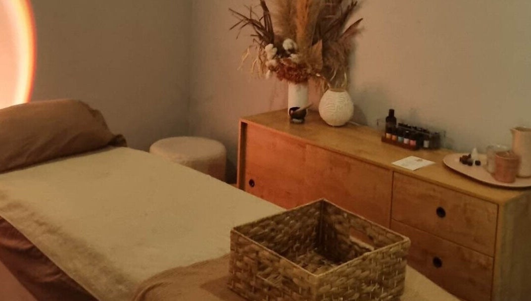 Calm therapy room at Balancing Her, Helensvale, Queensland, AU with massage bed and soothing decor.