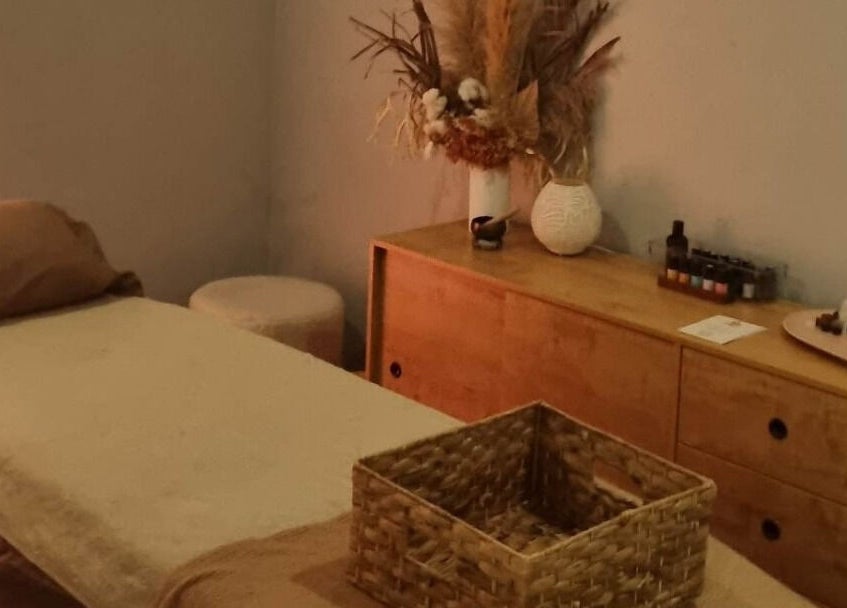 Calm therapy room at Balancing Her, Helensvale, Queensland, AU with massage bed and soothing decor.