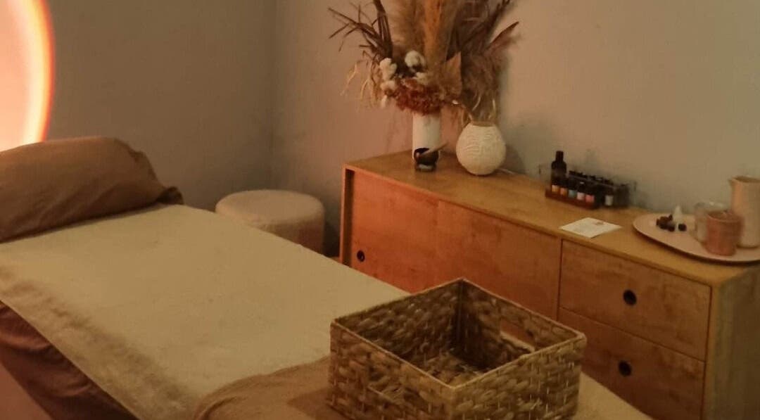 Calm therapy room at Balancing Her, Helensvale, Queensland, AU with massage bed and soothing decor.