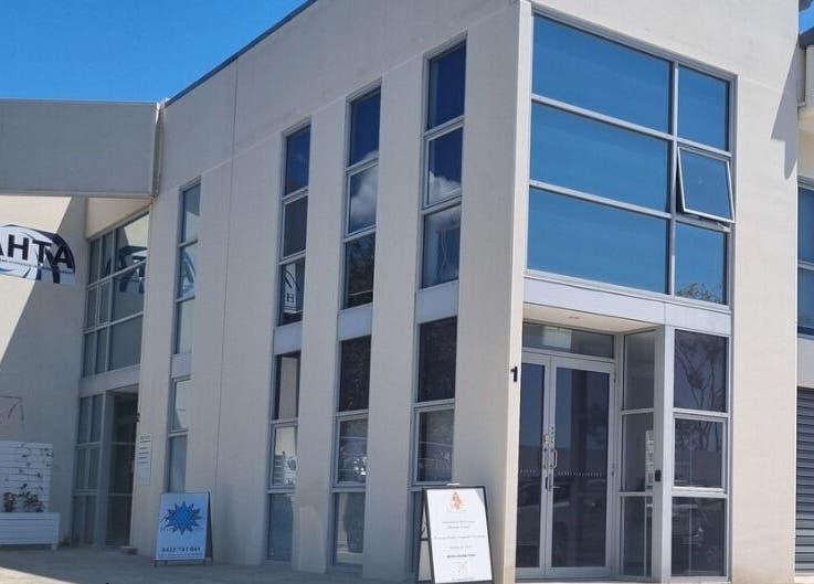 Balancing Her wellness venue exterior in Helensvale, Queensland, AU featuring modern architecture with glass facade.