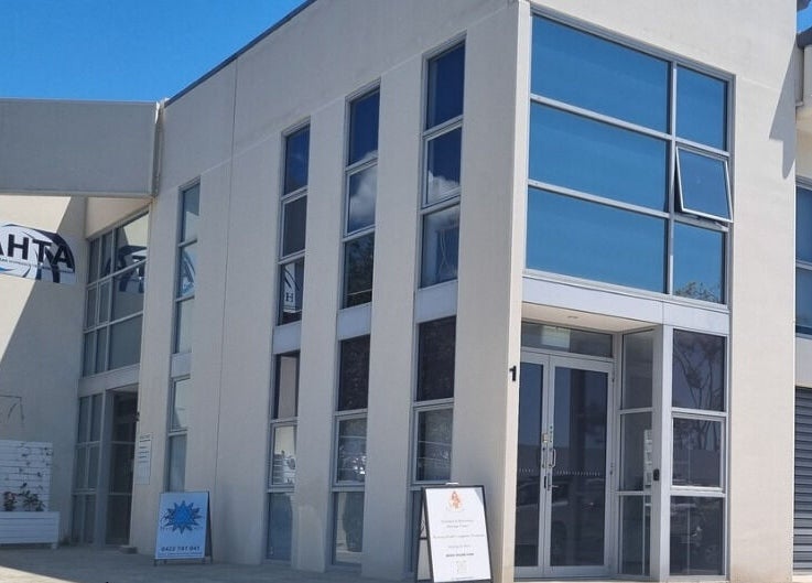 Balancing Her wellness venue exterior in Helensvale, Queensland, AU featuring modern architecture with glass facade.