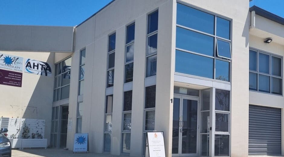 Balancing Her wellness venue exterior in Helensvale, Queensland, AU featuring modern architecture with glass facade.
