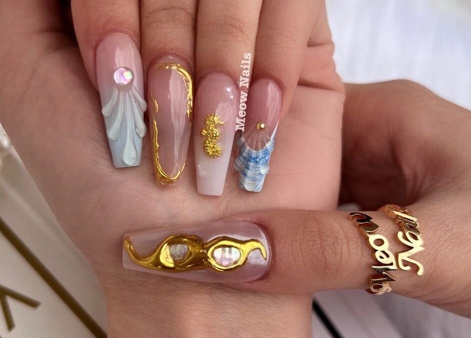 Intricate nail art at Meow Nails Mawson Lakes, showcasing gold accents and crystals in Mawson Lakes, South Australia, AU.